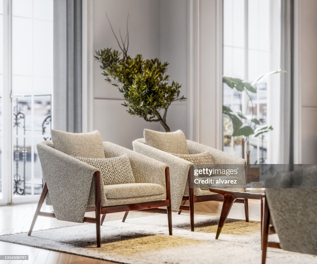 Poltrone eleganti in un soggiorno illuminato