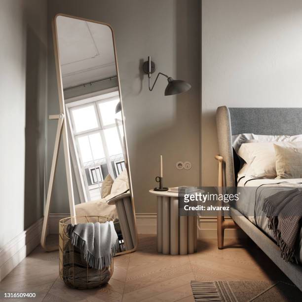 large mirror in the corner of bedroom - small bedroom stock pictures, royalty-free photos & images