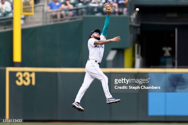 Crawford of the Seattle Mariners cannot catch the ball against the Baltimore Orioles during the second inning at T-Mobile Park on May 05, 2021 in...