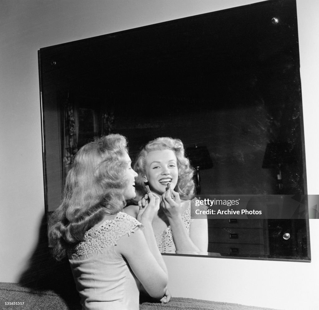 Monroe Puts On Lipstick