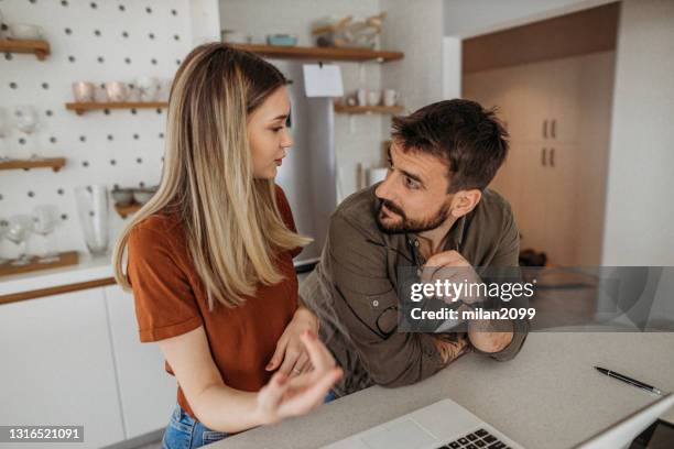 couple in the kitchen love happy - cutting costs stock pictures, royalty-free photos & images