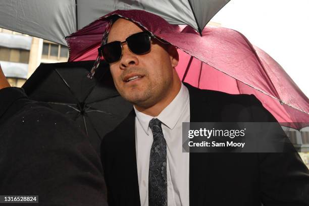 Jarryd Hayne arrives, surrounded by supporters, at Newcastle District Court on May 06, 2021 in Newcastle, Australia. Former NRL player Jarryd Hayne...