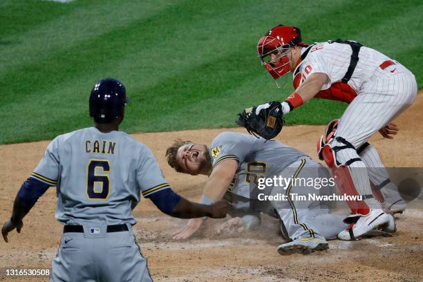 Realmuto of the Philadelphia Phillies tags out Daniel Vogelbach of the Milwaukee Brewers at the plate during the third inning at Citizens Bank Park...