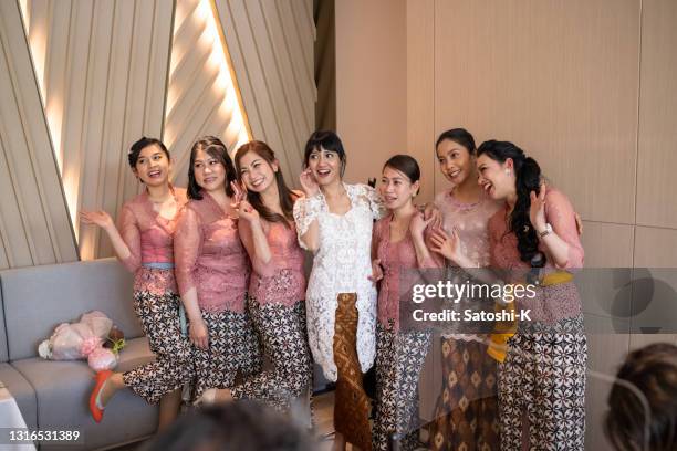 group shot of asian bride with bridesmaids - making faces - bridesmaid stock pictures, royalty-free photos & images