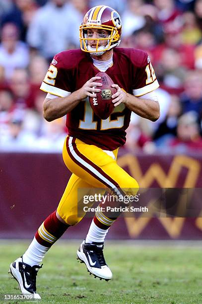 Quarterback John Beck of the Washington Redskins looks for open receivers against the San Francisco 49ers in the third quarter at FedExField on...