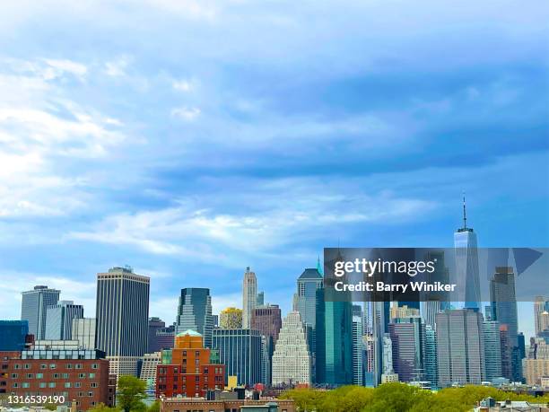 rooftops and towers of downtown brooklyn and lower manhattan, new york - manhattan skyline stock pictures, royalty-free photos & images