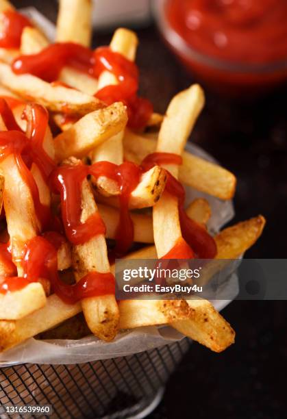 french fries with ketchup - tomato sauce stock pictures, royalty-free photos & images
