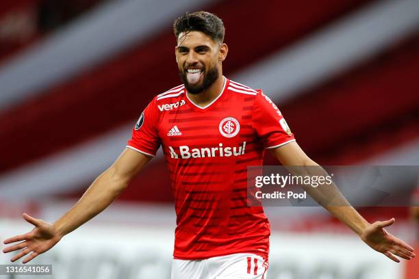 Yuri Alberto of Internacional celebrates after scoring the fifth goal of his team during a match between Internacional and Olimpia as part of Group B...