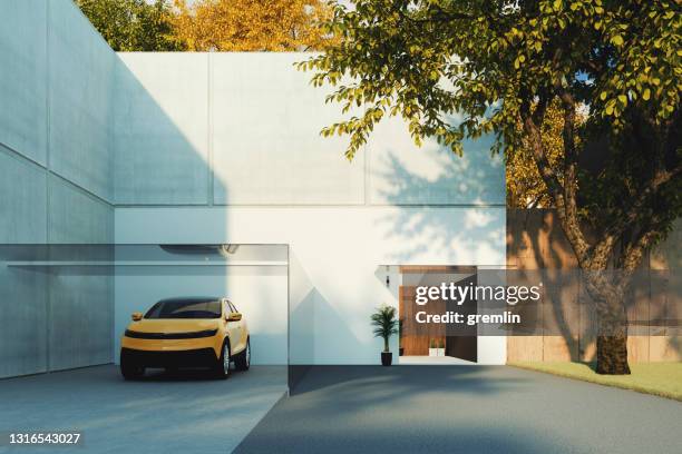 generic modern concrete house - car in garage stock pictures, royalty-free photos & images