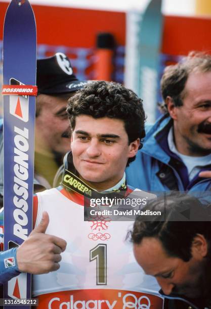 Alberto Tomba of Italy celebrates his gold medal performance in the Giant Slalom event of the Alpine Skiing Competition of the Winter Olympic Games...