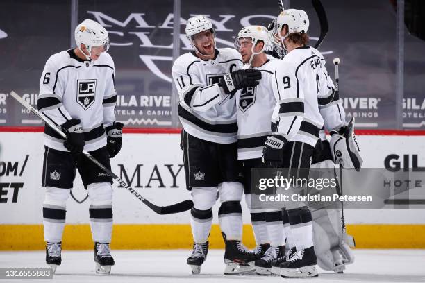 Anze Kopitar of the Los Angeles Kings is congratulated by Olli Maatta, Sean Walker, goaltender Calvin Petersen and Adrian Kempe for recording his...