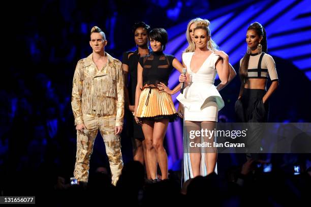 Fashion designer Jeremy Scott and Daisy Evans, Ashley Shaw, Chelsey Reynolds, Monique Roberts, Seyi Odedere of girl group From Above onstage during...