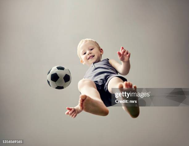 small boy with soccer ball - baby football foto e immagini stock