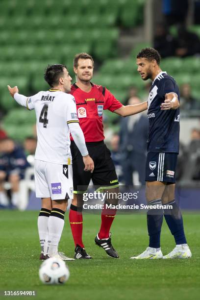 Benat Etxebarria of Macarthur FC and Rudy Gestede of the Victory speak with the referee during the A-League match between Melbourne Victory and...