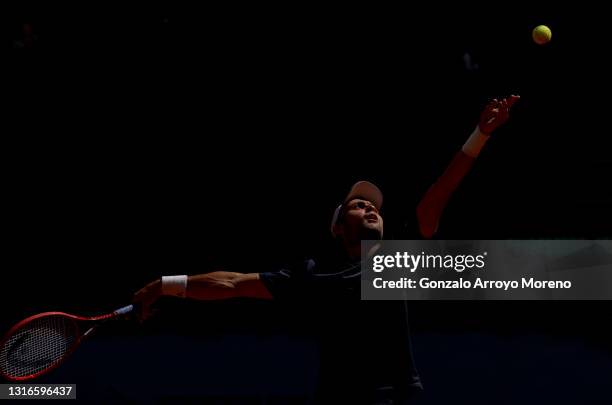 Aslan Karatsev of Russia serves during his third round match against Alexander Bublik of Kazakhstan during day eight of the Mutua Madrid Open at La...