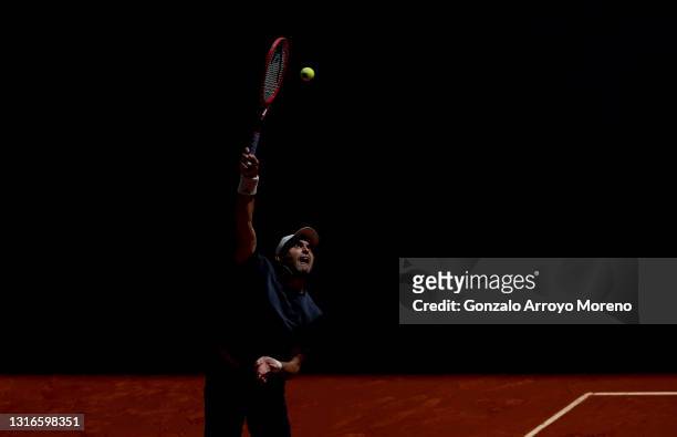Aslan Karatsev of Russia serves during his third round match against Alexander Bublik of Kazakhstan during day eight of the Mutua Madrid Open at La...