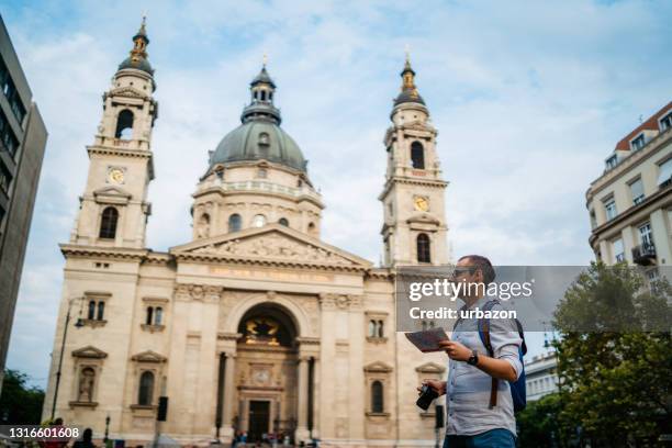 tourist man exploring budapest - budapest map stock pictures, royalty-free photos & images