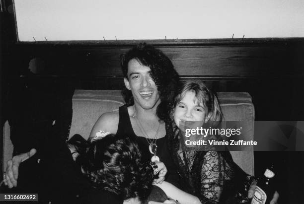 Actress Drew Barrymore and singer Stephen Pearcy at nightclub Limelight, New York City, US, circa 1987.