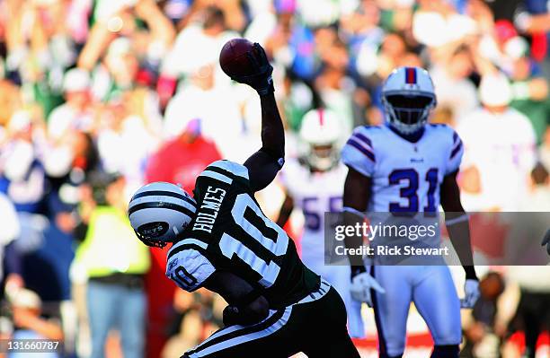 Santonio Holmes of the New York Jets spikes the ball after scoring a touchdown against the Buffalo Bills at Ralph Wilson Stadium on November 6, 2011...