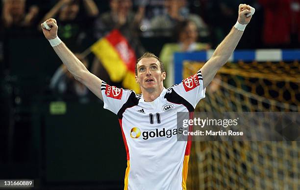 Holger Glandorf of Germany celebrates after scoring during the Mens' Handball Supercup match between Germany and Spain at Gerry Weber stadium on...