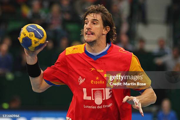 Viran Morros of Spain throws the ball during the Mens' Handball Supercup match between Germany and Spain at Gerry Weber stadium on November 6, 2011...