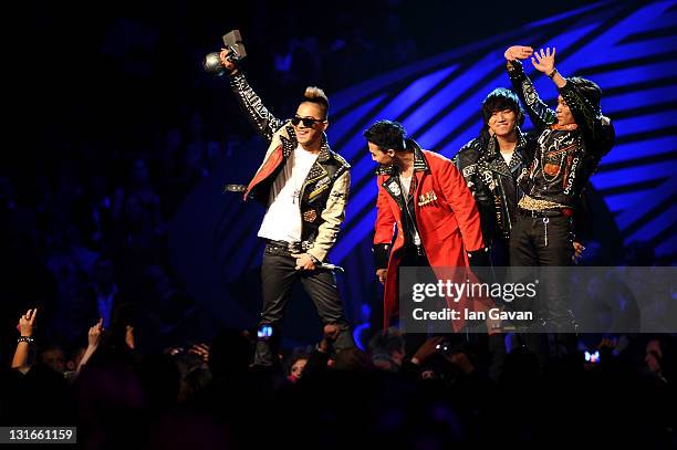 Dragon, Taeyang, T.O.P, Daesung and Seungri of Korean band Bigbang receive the Best Worldwide Award during the MTV Europe Music Awards 2011 live show...