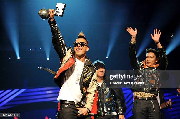 Dragon, Taeyang, T.O.P, Daesung and Seungri of Korean band Bigbang receive the Best Worldwide Award during the MTV Europe Music Awards 2011 live show...