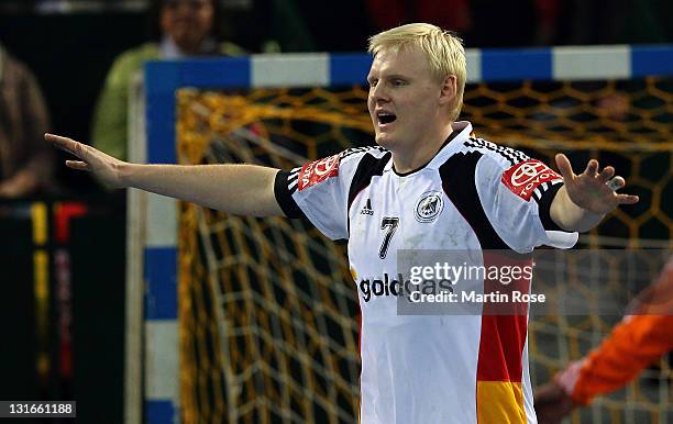 Patrick Wiencek of Germany gestures during the Mens' Handball Supercup match between Germany and Spain at Gerry Weber stadium on November 6, 2011 in...