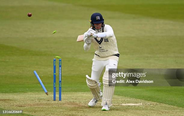 Peter Handscomb of Middlesex is bowled with out playing a shot by David Payne of Gloucestershire during Day One of the LV= Insurance County...