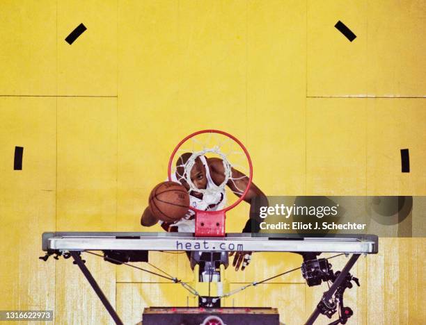 Alonzo Mourning, Center and Power Forward for the Miami Heat looks up through the basketball hoop after making a lay up shot during Game 1 of the NBA...
