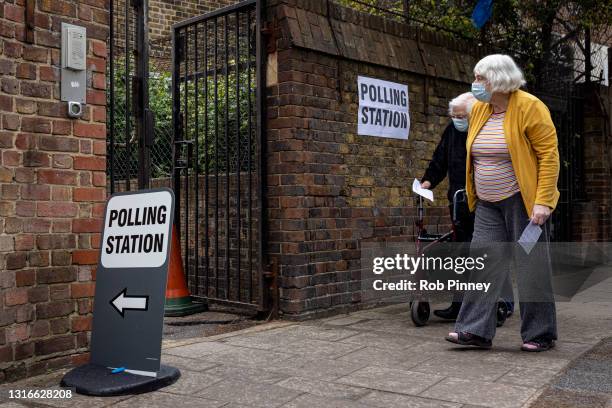 Two woman going to vote at a polling station on May 06, 2021 in London, England. The London mayoral election takes place today a year after the...