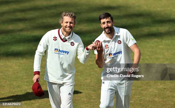 Gareth Berg and Ben Sanderson of Northamptonshire who both took five wickets celebrate after bowling out Sussex for 106 during the LV=Insurance...