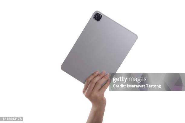 hand holding rear tablet isolated on white background - tablet halten stock-fotos und bilder