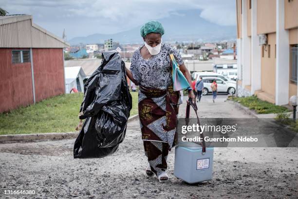Health worker walks through the courtyard during the COVID-19 vaccination campaign on May 05, 2021 in Goma, Democratic Republic of Congo. The central...