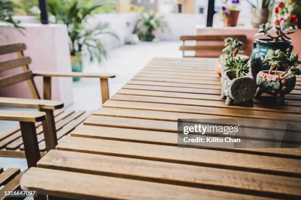 patio furniture and potted plant-tranquil scene - garden furniture foto e immagini stock