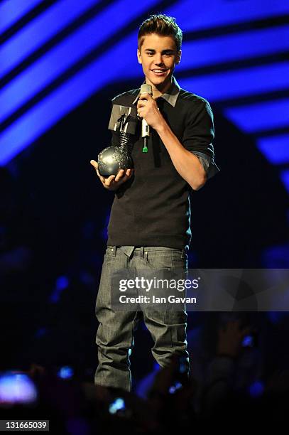 Singer Justin Bieber receives the award for Best Pop during the MTV Europe Music Awards 2011 live show at the Odyssey Arena on November 6, 2011 in...