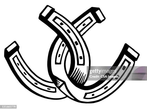 two horseshoes - horseshoe stock illustrations