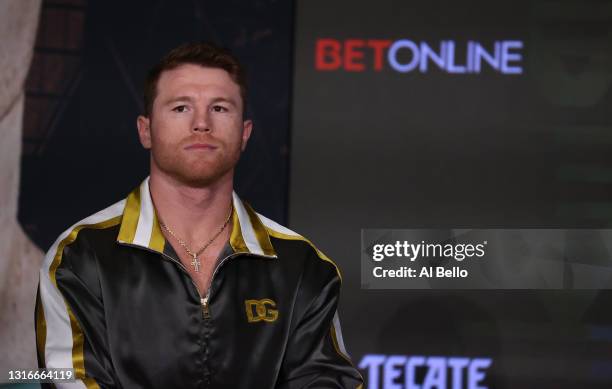 Canelo Alvarez looks on against Billy Joe Saunders during the press conference for Alvarez's WBC and WBA super middleweight titles and Saunders' WBO...