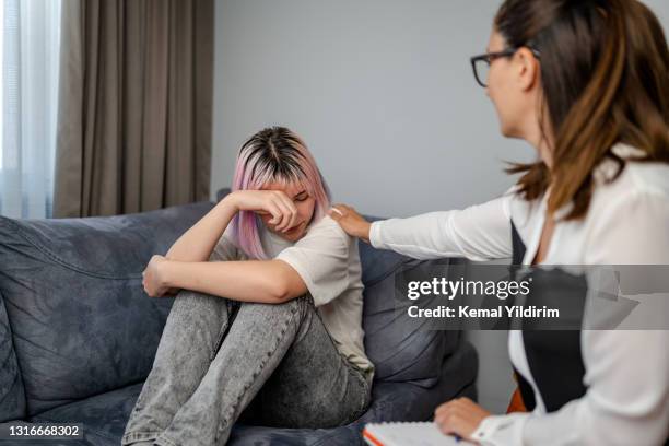 therapist support her patient and encourage her. - bad news stock pictures, royalty-free photos & images