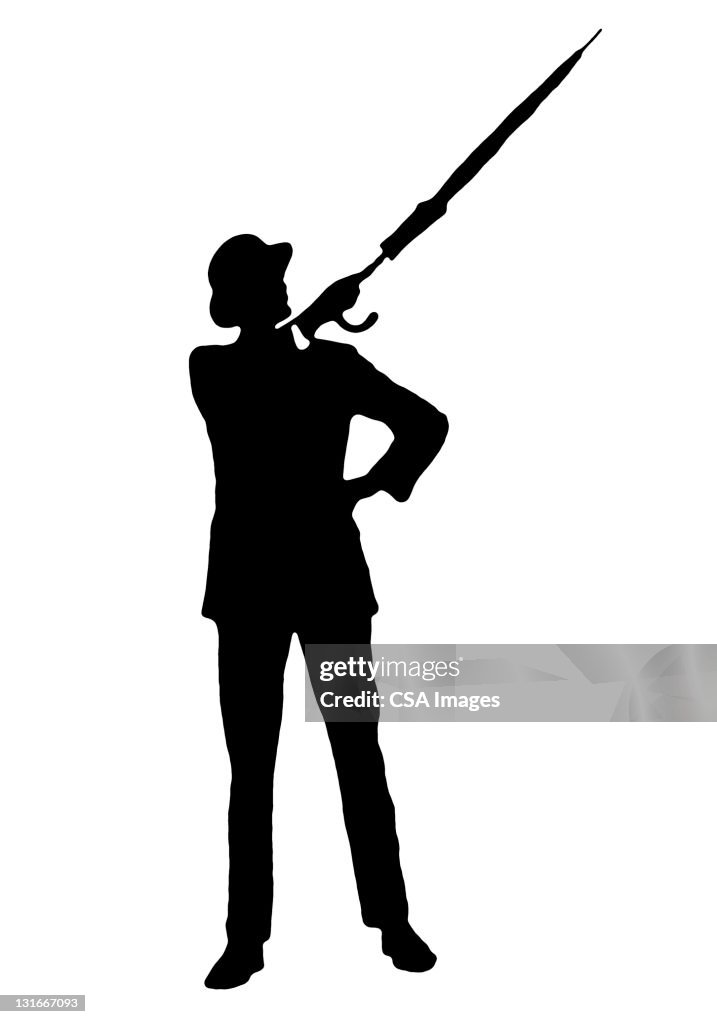 Silhouette of Man Pointing With Umbrella