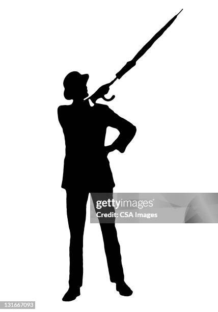 silhouette of man pointing with umbrella - bowler hats stock illustrations