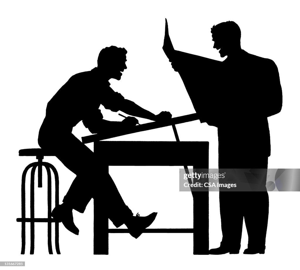 Silhouette of Two Men Working