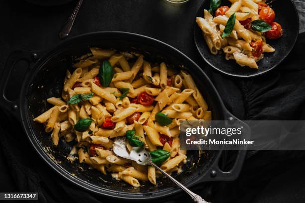 feta tomato pasta - feta stock pictures, royalty-free photos & images