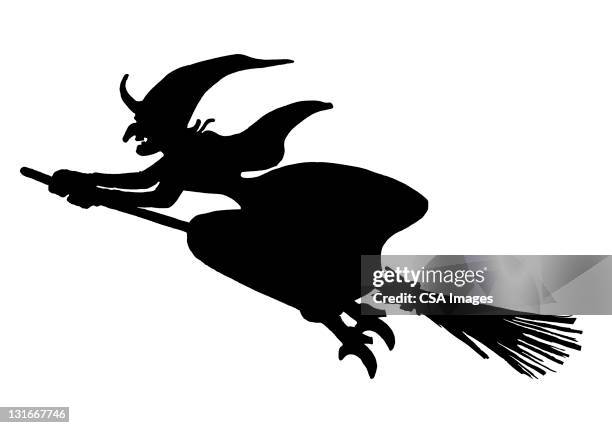silhouette of witch on broom - witch flying on broom stock-grafiken, -clipart, -cartoons und -symbole