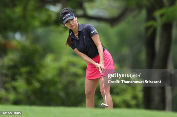 Muni He of China putts on green during the first round of the Honda LPGA Thailand at the Siam Country Club Pattaya Old Course on May 06, 2021 in...