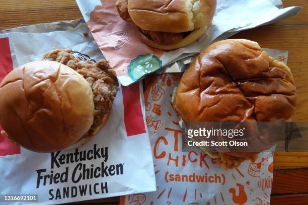 Fast-food chicken sandwiches from McDonald's, Popeyes Louisiana Kitchen and KFC are shown on May 06, 2021 in Chicago, Illinois. Chicken prices have...