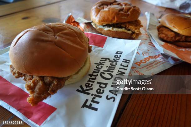 Fast-food chicken sandwiches from McDonald's, Popeyes Louisiana Kitchen and KFC are shown on May 06, 2021 in Chicago, Illinois. Chicken prices have...