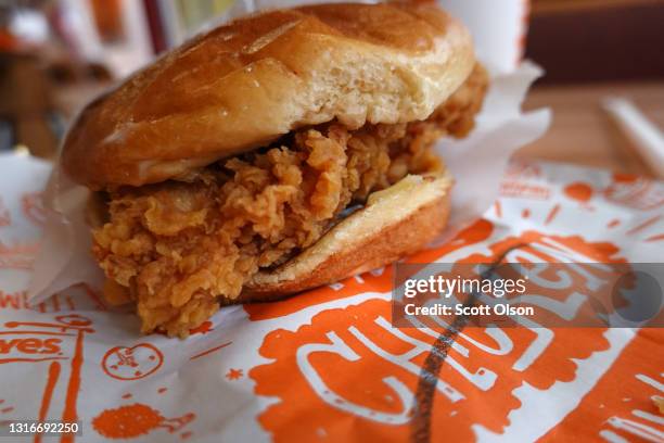 Chicken sandwich from Popeyes Louisiana Kitchen is shown on May 06, 2021 in Chicago, Illinois. Chicken prices have risen sharply this year as...
