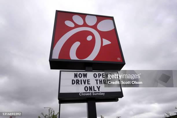 Sign hangs outside of a Chick-fil-A restaurant on May 06, 2021 in Chicago, Illinois. Chicken prices have risen sharply this year as suppliers...