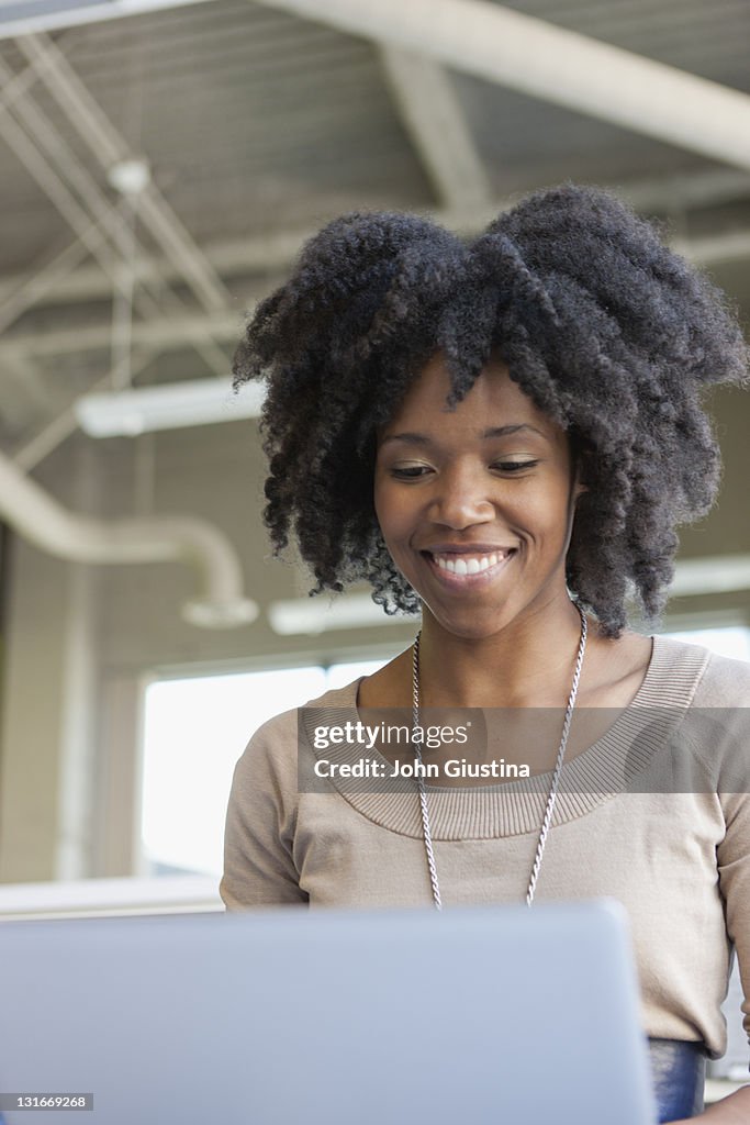 Businesswomen using laptop in office